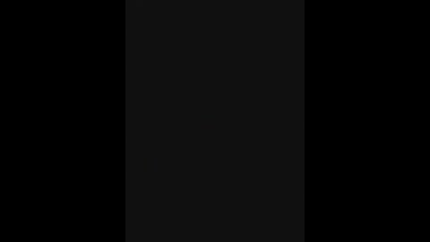 A minimalist digital artwork featuring a solid black vertical rectangle set against a pitch-black background, creating a stark contrast and emphasizing the rectangular shape. The image has no additional elements or textures, focusing solely on the geometric form.