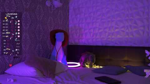 Video of a dimly lit bedroom with purple lighting. A mannequin wearing a red cowboy hat is positioned on a bed, surrounded by plush toys and a glowing circular light.