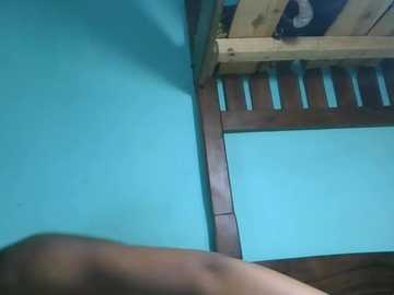 Video of a child's room corner with a wooden bunk bed, turquoise walls, and a lower bed visible.