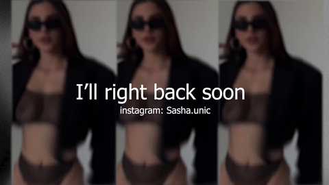Video of three identical women in black lingerie and jackets, blurred faces, wearing dark sunglasses, with text overlay: \"I'll right back soon: Instagram: Sashahun\