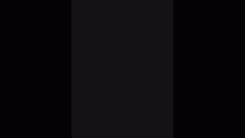 A video featuring a black vertical rectangle on a black background, creating a stark contrast and emphasizing the simplicity and minimalism of the image.