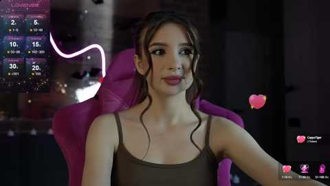 Media: Photorealistic CGI image of a young woman with fair skin, brown hair, and dark makeup, seated in a pink chair, wearing a brown tank top.