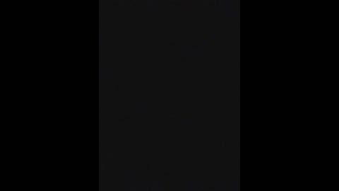 Media: A digital video featuring a stark vertical black and white pattern. The background is solid black, and the center is a vertical white stripe. The contrast is high, creating a striking visual effect.