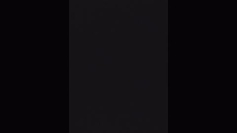 A minimalist digital image featuring a vertical black rectangle against a dark background, creating a stark contrast. The style is clean and modern, emphasizing simplicity and depth.