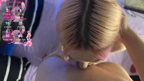 Media: A video shows a blonde woman in a pink dress performing oral sex on a man's penis, in a bedroom setting. The image includes a virtual reality interface with stats.