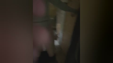 Media: A blurred video of a close-up view of a person's mouth, possibly in a dimly lit room. The image is out of focus, making it difficult to discern specific details.