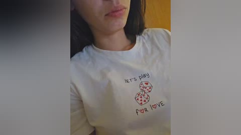 Media: Video of a woman in a white shirt with \"Let's play poker, fox love\" text and poker chip graphic. She has long, dark hair and fair skin.