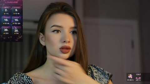 Media: Video of a young woman with fair skin and long brown hair, wearing a patterned top, with a digital weather app showing 30\u00b0C and cloudy conditions in the background.