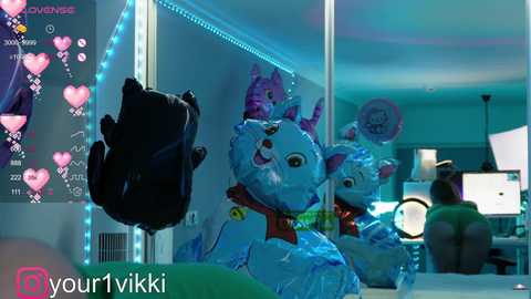 Media: A vibrant, digitally created image featuring a blue, plush cat with a red collar, surrounded by three similar plushies in a futuristic, neon-lit room.