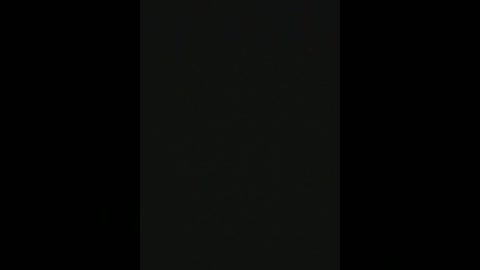 A minimalist digital artwork featuring a single vertical black rectangle against a black background, with a subtle gradient effect creating a slight shadow on the right side.