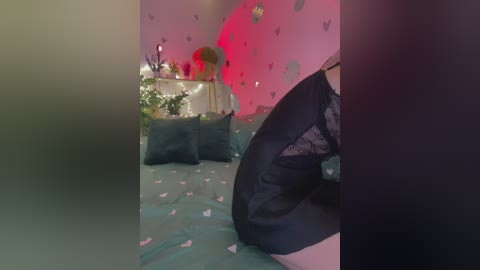 Video of a dimly lit bedroom with pink walls, butterfly decals, teal bedspread, and black lace panties partially visible.