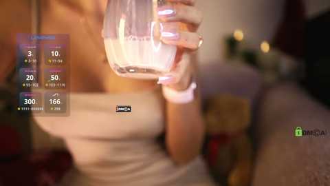 Media: Video of a woman holding a glass of water, wearing a white tank top, with a blurred background and digital overlay showing a \"LIVE\" label and water consumption stats.