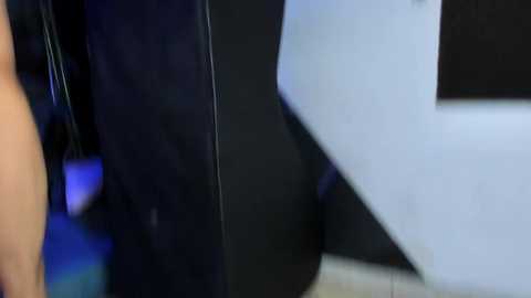 Media: A close-up video of three large, black and white letters on a light-colored surface, likely at a museum exhibit. The letters are glossy, and the background is blurred, focusing on the letters' textures and shapes.
