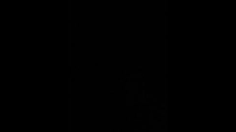 A simple, minimalist video of a solid black background, devoid of any objects or visible textures. The image is entirely black, creating an abstract, monochromatic effect.