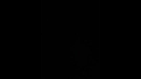 Video of a completely black background with no discernible objects or features, creating an empty, void-like atmosphere. The image has a minimalist aesthetic, emphasizing the absence of visual elements.