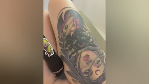 A close-up video of a person's forearm showing a vibrant, detailed tattoo of a woman's face and floral design, with a black and pink color palette.