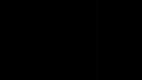 A minimalist, black-and-white video featuring a stark, empty black background. The image is devoid of any objects, textures, or visible details, creating a stark, minimalist aesthetic.