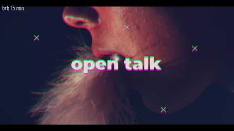 A close-up video of a person's mouth with a fuzzy, textured beard, illuminated by a soft, pinkish glow. The text \"open talk\" is overlaid in a glitchy, neon green font, with \"btr 15 min\" in the top left corner.