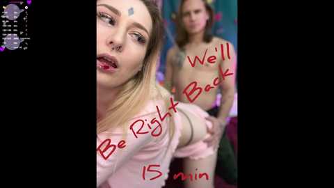 Video of a young blonde woman in a pink shirt and shorts, with \"Be Right Back 15 min\" and \"Well Back\" written in red.