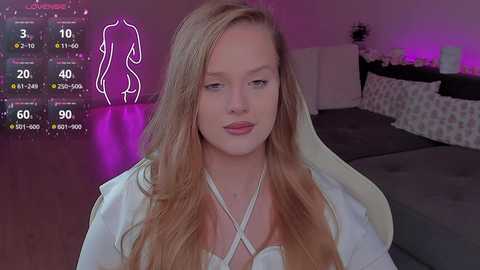 Video of a young, fair-skinned woman with long, wavy blonde hair, wearing a white dress, sitting in a bedroom with purple lighting. Overlay shows virtual avatar stats.