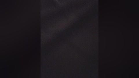 A video of a dark, starless night sky with a faint, wispy cloud in the center, creating a mysterious, almost ethereal atmosphere.