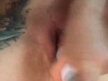 Video of a close-up, blurred image showing a nude female's vulva, with light skin tone and visible labia. The background is out of focus.