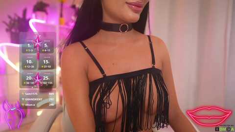 Video of a woman with long black hair and a black fringe top, wearing a black choker. Background features a neon sign and digital stats.