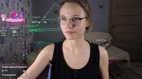 Video of a young, fair-skinned woman with glasses, brown hair, and a black sleeveless top, standing in a dimly lit bedroom with a pink wall, a bed, and a digital green screen overlay showing \"McDonald's\" and \"McDonald's promotion.\