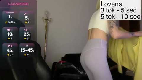 A video shows a woman in a yellow top and tight gray leggings bending over, with a digital timer counting down from 5:10 seconds in the background.