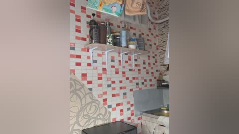 Video of a small, cozy kitchen with white subway tiles, red mosaic backsplash, wooden shelves holding kitchen utensils, and a rustic countertop.