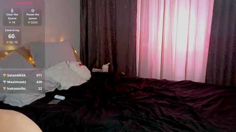 A video of a dimly lit bedroom with dark curtains, a messy bed, and digital overlays showing user activity and location details.
