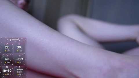 A close-up video of a light-skinned person's bare leg, taken from a low angle. The background is blurred. A digital display in the bottom left shows a temperature of 10.5\u00b0C.