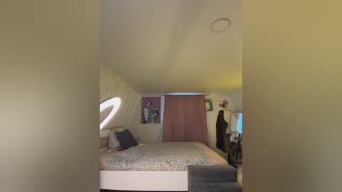 A video of a modern, minimalist bedroom with a loft bed, a white chair, and a pink curtain, showcasing a cozy and clutter-free space.