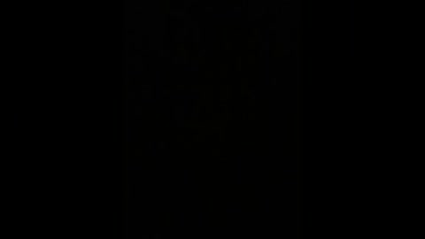 A video of a black, seamless background with no discernible objects or details, creating an abstract, minimalist aesthetic. The image is devoid of color and texture, emphasizing emptiness and simplicity.