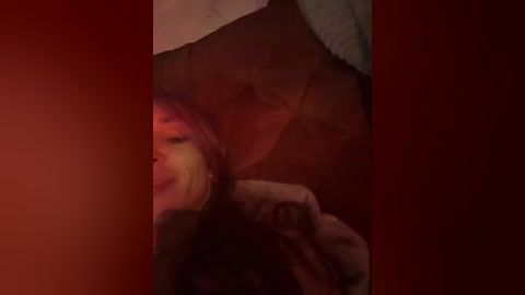 A video featuring a close-up of a woman with medium-length brown hair and fair skin, smiling, partially obscured by a large, dark umbrella. The background is a deep red, creating a dramatic, intimate atmosphere.