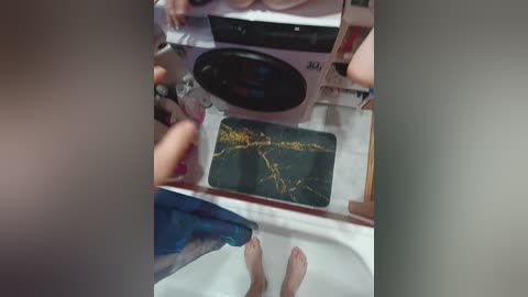 A video of a person standing on a tiled floor, capturing a close-up of a smartphone screen displaying a map. The image is slightly blurred.