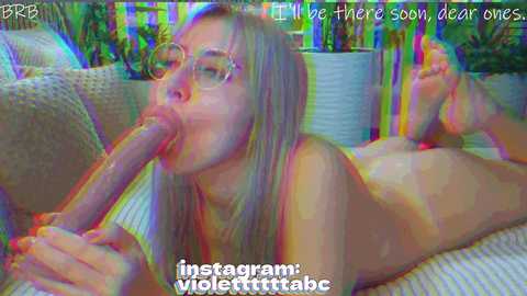 A vibrant, colorful video of a nude, fair-skinned woman with long blonde hair, wearing glasses, performing oral sex on a large, erect penis, with a background of potted plants and a couch.