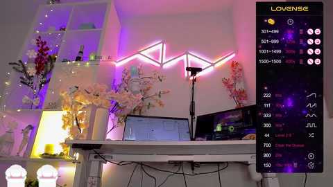 Video of a cozy, modern study room with a white desk, laptop, plants, and a pink neon light backdrop. A live stream display on the right shows 7,300+ viewers.