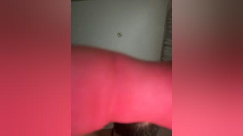 A video featuring a close-up view of a woman's bare buttocks, with a red filter over the image, creating a dramatic and sensual effect.