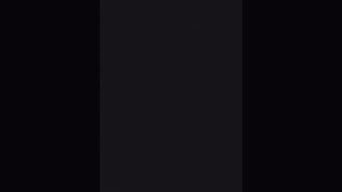Video of a black-and-white vertical rectangle on a black background, with subtle, barely noticeable texture variations. The rectangle is centered, with a slightly lighter hue towards the top, suggesting a gradient.