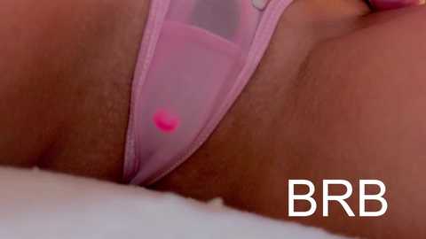 Video of a woman's upper thigh and crotch area in pink sheer panties with a visible pink stain, close-up, with \"BBR\" logo in the bottom right.